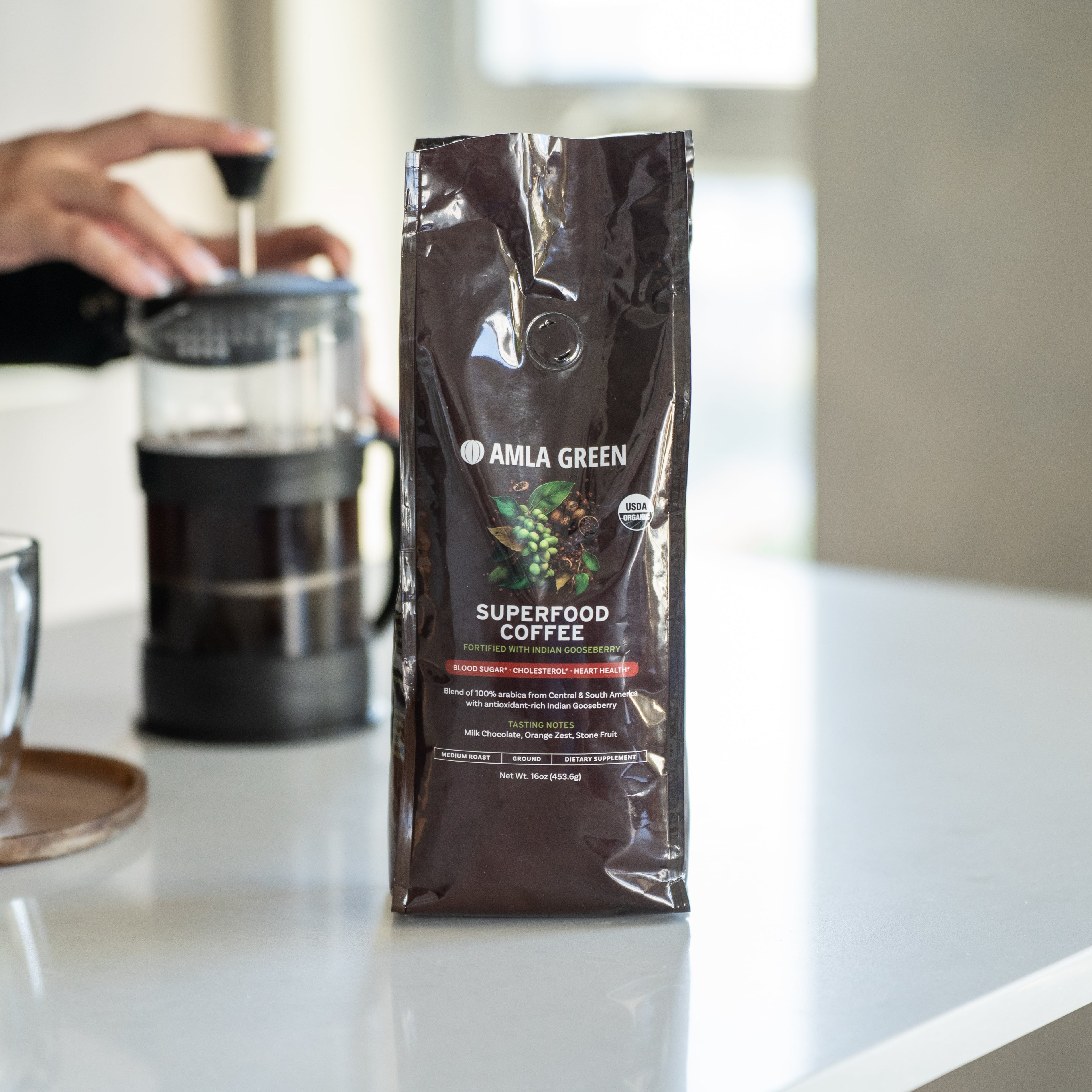 Whole and cut green gooseberry on black background.